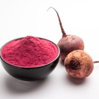 Heap of Beetroot or Beet Root powder with raw whole contains the essential minerals iron, potassium, and magnesium